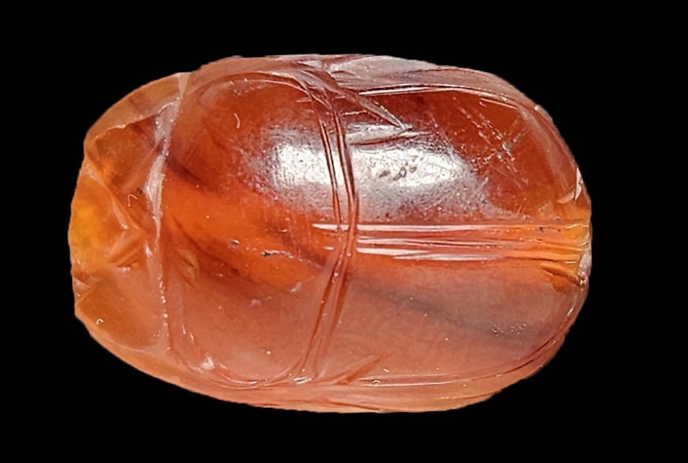 The back of the stone is engraved to resemble a dung beetle, or “scarab.” Photo by Anastasia Shapiro, Israel Antiquities Authority