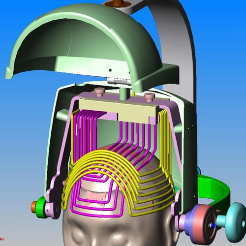 3D rendering of a medical or scientific device surrounding a human head model, featuring various colored components and wires.