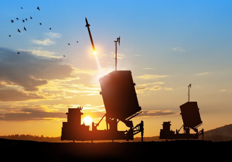 Israel's Iron Dome air-defense missile launches, aimed at the sky at sunset. Photo by Hamara via Shutterstock.com