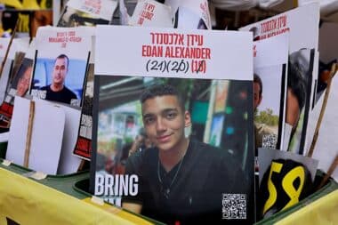 A sign showing the face of Israeli-US hostage Edan Alexander (C), who has been held by Hamas in Gaza since October 2023, is pictured among portraits of other Israelis held captive in Gaza at Hostages Square in Tel Aviv on May 12, 2025.