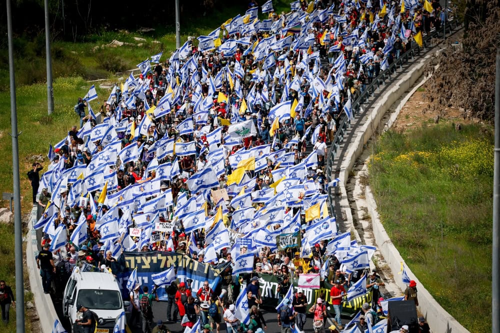 Israelis protesting the decision of Israeli Prime Minister Benjamin Netanyahu to fire Shin Bet director Ronen Bar, blocking Highway 1 near Jerusalem, March 18, 2025. Photo by Yonatan Sindel/Flash90