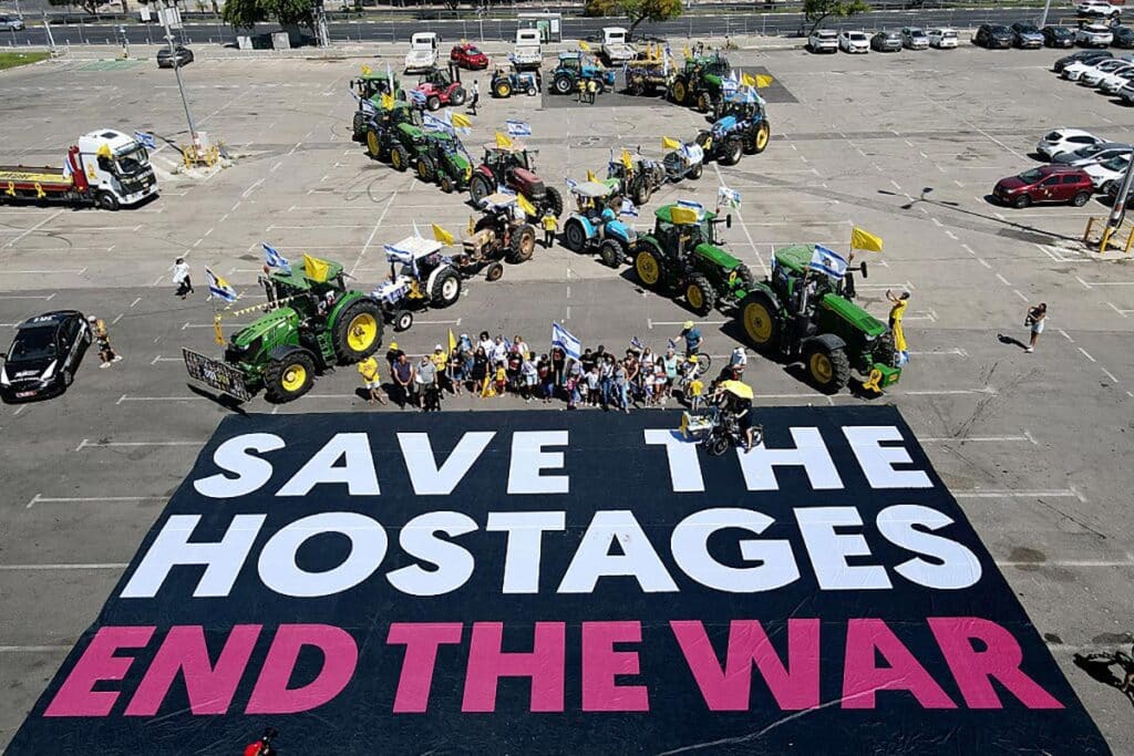 An aerial picture shows a tractor protest organised by the Kibbutz Movement and the Hostages Families, before the convoy heads towards Hostages Square in the Israeli coastal city of Tel Aviv on May 31, 2025, to mark over 600 days since Israelis were taken hostage by Palestinian terrorists in Gaza in October 2023, demand action to get them released and end the war.