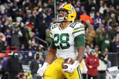 BALTIMORE, MARYLAND - DECEMBER 19: A.J. Dillon #28 of the Green Bay Packers reacts scoring on a rushing touchdown against the Baltimore Ravens in the second quarter at M&T Bank Stadium on December 19, 2021 in Baltimore, Maryland. (Photo by Rob Carr/Getty Images)