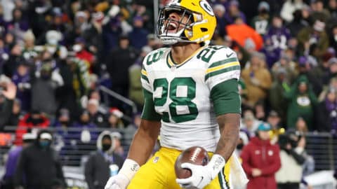 BALTIMORE, MARYLAND - DECEMBER 19: A.J. Dillon #28 of the Green Bay Packers reacts scoring on a rushing touchdown against the Baltimore Ravens in the second quarter at M&T Bank Stadium on December 19, 2021 in Baltimore, Maryland. (Photo by Rob Carr/Getty Images)