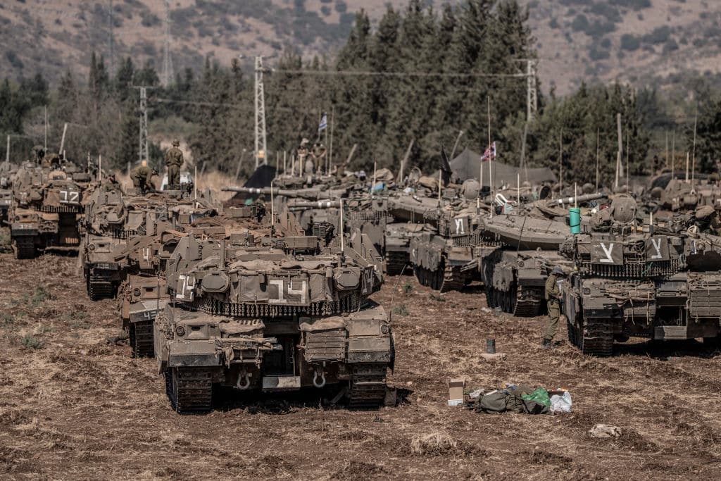 28 September 2024, Israel, ---: Israeli military tanks gather by the Israeli-Lebanon border. Photo: Ilia Yefimovich/dpa (Photo by Ilia Yefimovich/picture alliance via Getty Images)