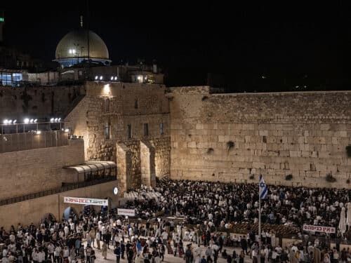 Ultra-Orthodox Jewish men gather for prayers and a reading from the biblical Book of Lamentations at the Western Wall in Jerusalem's Old City on August 2, 2025, during the annual Tisha B'Av (Ninth of Av) fasting and memorial day, commemorating the destruction of ancient Jewish temples some 2000 years ago. (Photo by Menahem Kahana / AFP) (Photo by MENAHEM KAHANA/AFP via Getty Images)
