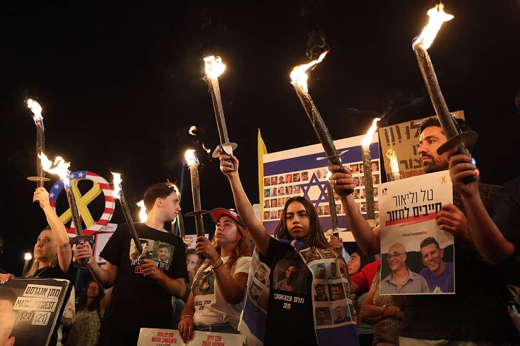 JERUSALEM - AUGUST 7: People stage a demonstration to call ceasefire in Gaza and for Israeli hostages to be released in front of the Prime Minister's Office, where the Israeli government has gathered to discuss a possible ground operation in Gaza, in Jerusalem on August 7, 2025. (Photo by Saeed Qaq/Anadolu via Getty Images)
