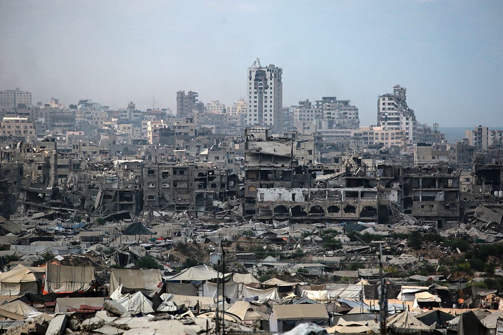 Tents used as temporary shelters by displaced Palestinians are set up near war-damaged buildings in Gaza City on August 8, 2025. Israel's military will "take control" of Gaza City under a plan proposed by Prime Minister Benjamin Netanyahu and approved by his security cabinet, triggered a wave of criticism from across the world. (Photo by Bashar TALEB / AFP) (Photo by BASHAR TALEB/AFP via Getty Images)