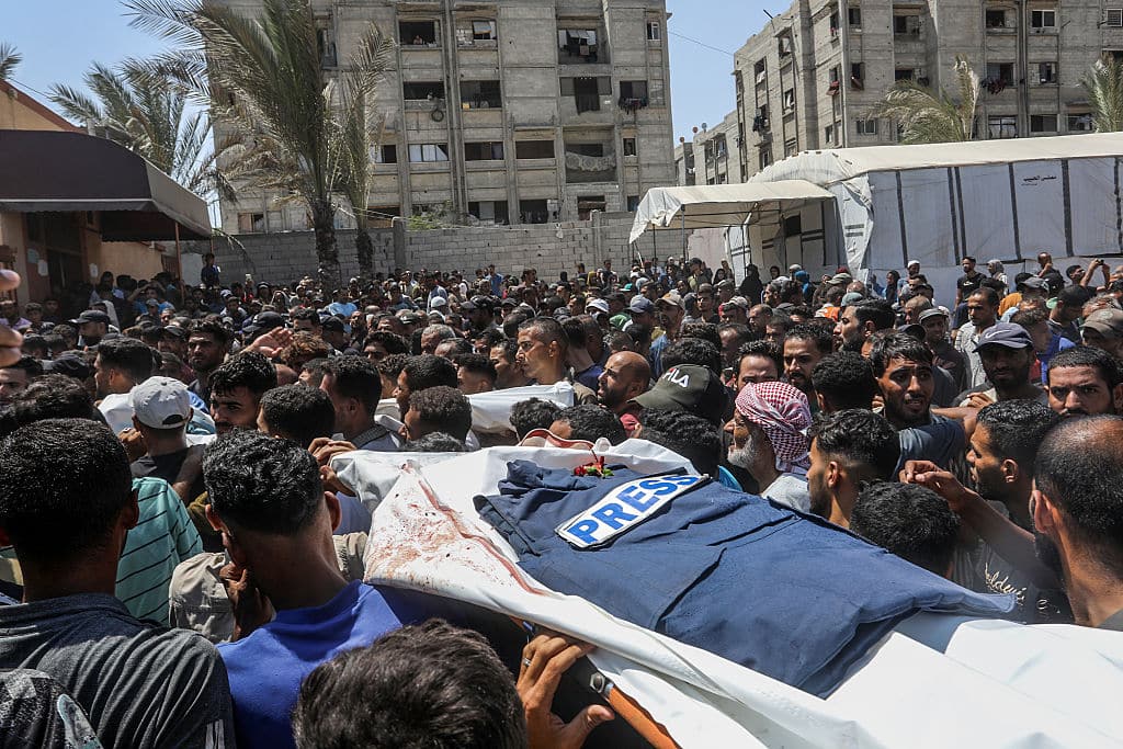 KHAN YUNIS, GAZA - AUGUST 25: A funeral ceremony is being held in the courtyard of Nasser Hospital for Reuters photojournalist Hossam al-Masri, Al Jazeera cameraman Mohammed Salameh, journalist Maryam Abu Deqqa, who worked with several media outlets including Independent Arabia and AP, and NBC News journalist Moaz Abu Taha, all of whom were killed in an Israeli attack on the hospital in Khan Yunis, Gaza on August 25, 2025. Relatives and colleagues of the slain journalists expressed deep grief during the ceremony. (Photo by Abed Rahim Khatib/Anadolu via Getty Images)