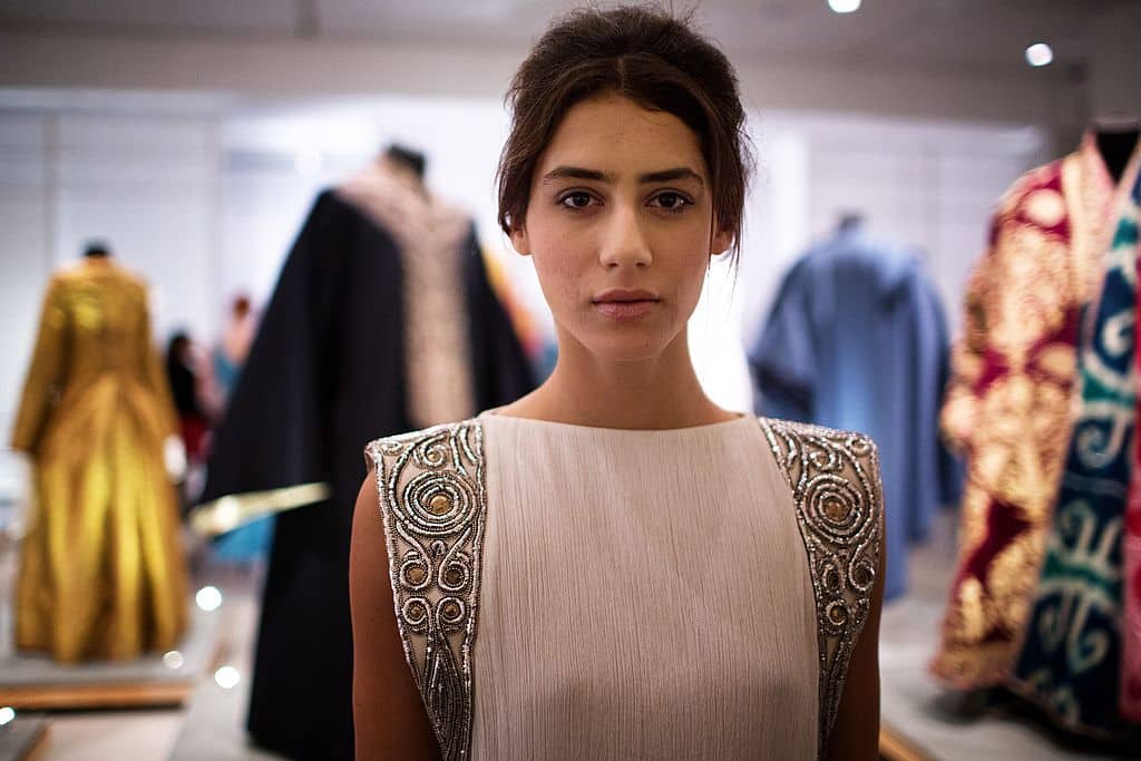 A model presents a creation by Israeli designer Maskit that is inspired by a ancient Jewish Tallit, a prayer shawl on March 25, 2014 during a fashion show as part of an exhibition of traditional Jewish women's clothes at the Israeli Museum in Jerusalem. The museum hosts an exhibition titled: "Dress Codes: Revealing the Jewish Wardrobe", bringing together an array of traditional apparel from the 18th through the 20th centuries from its collection of Jewish dress.  AFP PHOTO /MENAHEM KAHANA        (Photo credit should read MENAHEM KAHANA/AFP via Getty Images)