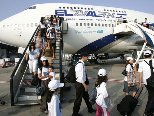 BEN GURION AIRPORT, ISRAEL: New Jewish immigrants making Aliyah (Immigration to Israel) from France walk down the airplane upon their arrival at the Ben Gurion International airport in Lod, about 15 kms east of Tel Aviv, 25 July 2007. At least 600 new French Jewish immigrants were expected to arrive to Israel assisted by the Jewish Agency for Israel, a record number of olim (immigrants) from France this year since 1972. AFP PHOTO/JACK GUEZ (Photo credit should read JACK GUEZ/AFP via Getty Images)