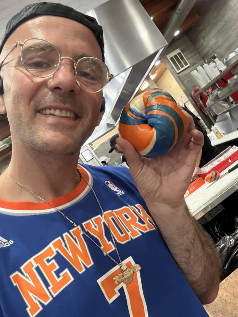 Kosha Dillz with a Knicks-themed bagel (courtesy of Kosha Dillz)