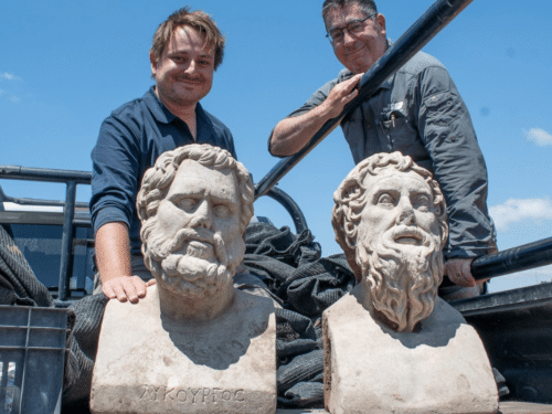 Archaeologists Eliran Oren and Michael Sorotskin with the Roman statues discovered in northern Israel.