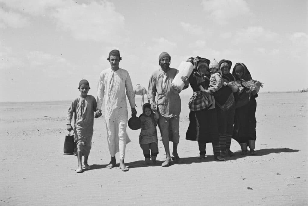 A Yemenite Jewish family walks toward a relocation camp to go to Israel, 1949 (Wikimedia Commons)