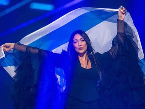 Yuval Raphael from Israel comes on stage with the national flag during a rehearsal for the final show of the 69th Eurovision Song Contest in the Arena St. Jakobshalle.
